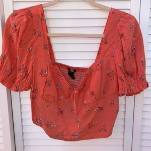 coral colored blouse with flowers